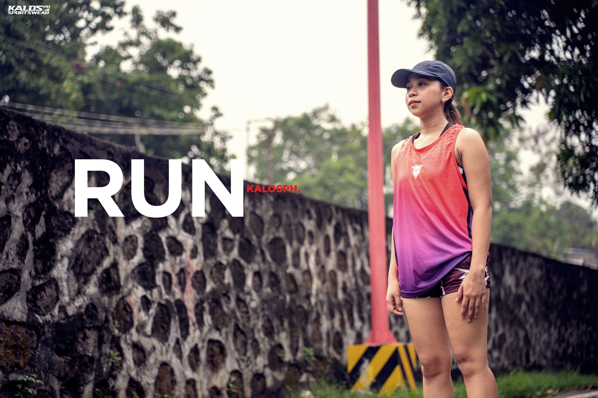 Runner wearing a vibrant custom jersey Philippines by Kalosph, showcasing breathable fabric and sleek design for optimal performance.
